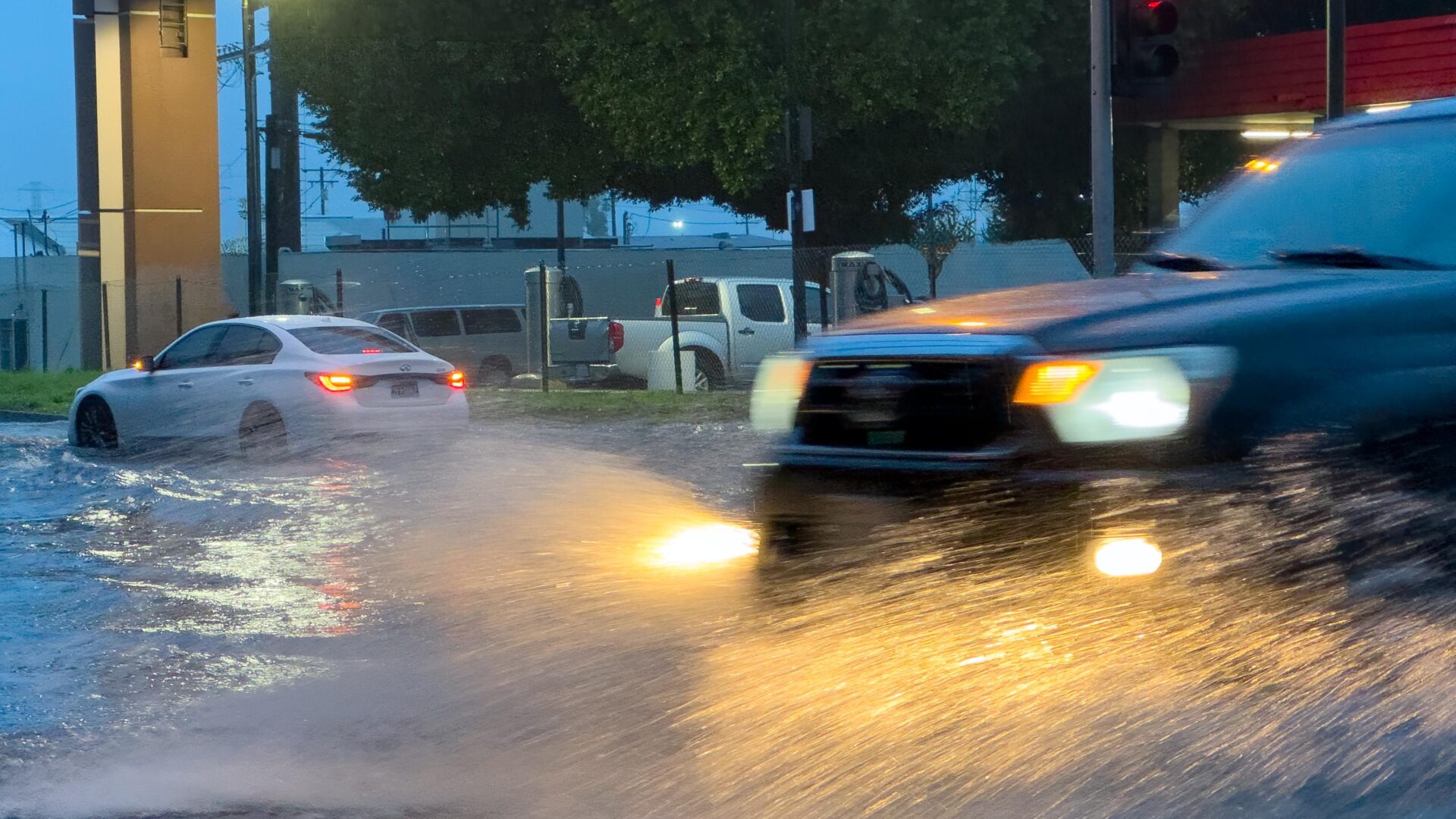 car driving through storm water